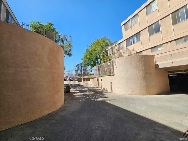 6979 Palm Ct Unit 126H, Riverside, CA 92506 - view of street with aphalt driveway