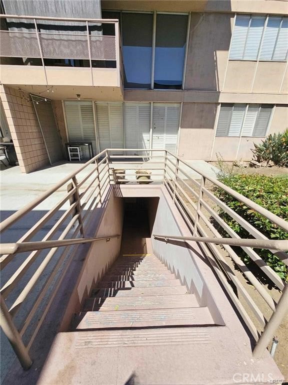 6979 Palm Ct Unit 126H, Riverside, CA 92506 - exterior space featuring a balcony and stucco siding
