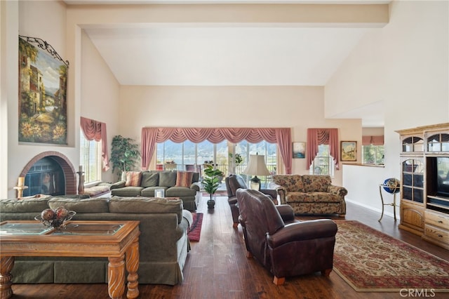 living area with high vaulted ceiling, a fireplace, baseboards, and wood finished floors