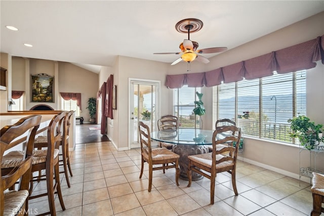 dining room with light tile patterned floors, ceiling fan, recessed lighting, and baseboards