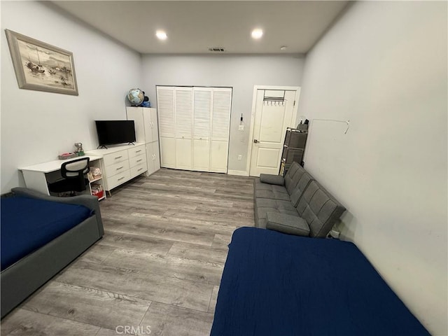 14615 Wyandotte St, Van Nuys, CA 91405 - bedroom with wood finished floors, a closet, visible vents, and recessed lighting