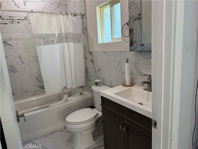 14615 Wyandotte St, Van Nuys, CA 91405 - full bath with vanity, toilet, marble finish floor, tile walls, and shower / tub combo