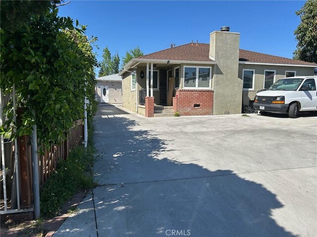 14615 Wyandotte St, Van Nuys, CA 91405 - exterior space with stucco siding, a chimney, crawl space, brick siding, and fence