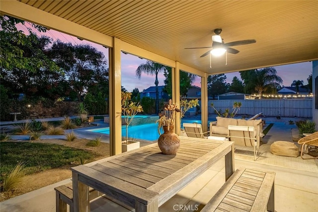 view of patio featuring a fenced backyard, ceiling fan, and a fenced in pool