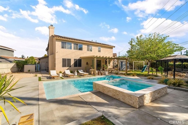 rear view of property with a chimney, fence, a playground, a patio, and stucco siding