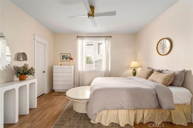bedroom featuring ceiling fan and wood finished floors