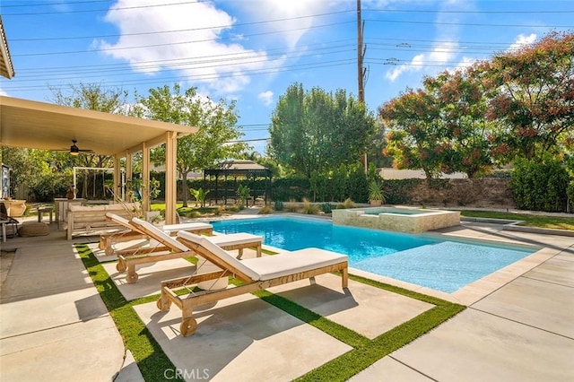 view of pool with a patio area, a gazebo, a ceiling fan, and a pool with connected hot tub