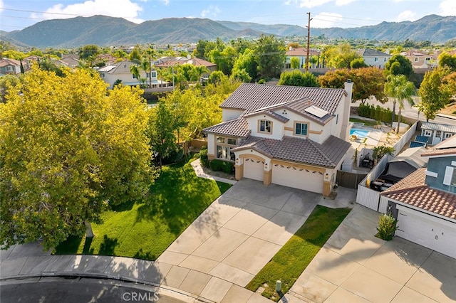 drone / aerial view with a residential view and a mountain view