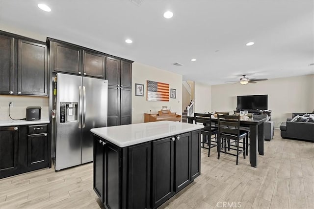 10969 Elkwood Cir, Riverside, CA 92503 - kitchen featuring stainless steel fridge, ceiling fan, light countertops, light wood-type flooring, and recessed lighting