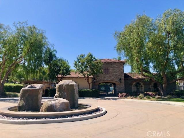 10969 Elkwood Cir, Riverside, CA 92503 - view of front of home featuring a tiled roof and stone siding