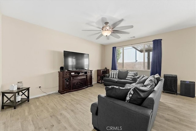 10969 Elkwood Cir, Riverside, CA 92503 - living room featuring ceiling fan, light wood-type flooring, and baseboards