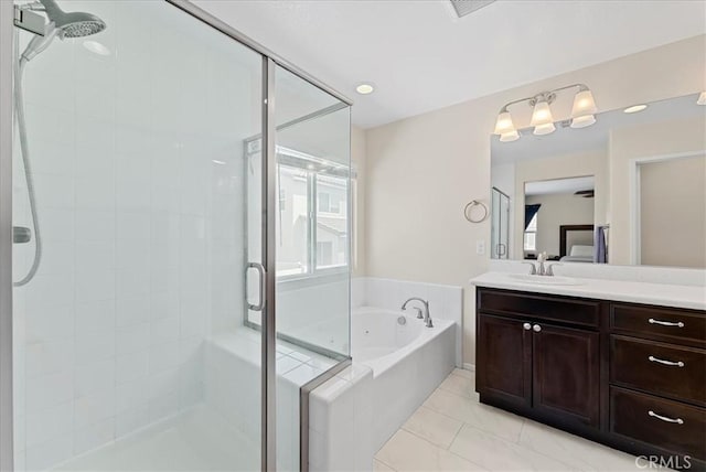 10969 Elkwood Cir, Riverside, CA 92503 - bathroom featuring a garden tub, a stall shower, vanity, and tile patterned floors