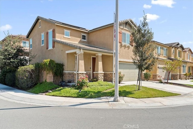 10969 Elkwood Cir, Riverside, CA 92503 - view of front of home featuring a garage, stucco siding, concrete driveway, and stone siding