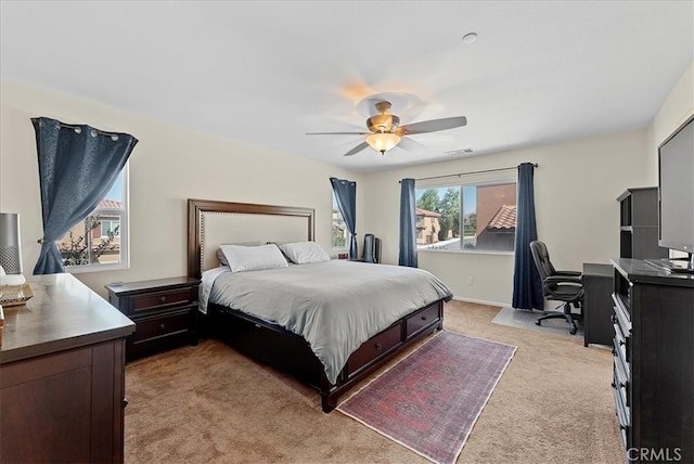 10969 Elkwood Cir, Riverside, CA 92503 - bedroom featuring light colored carpet, a ceiling fan, and a desk
