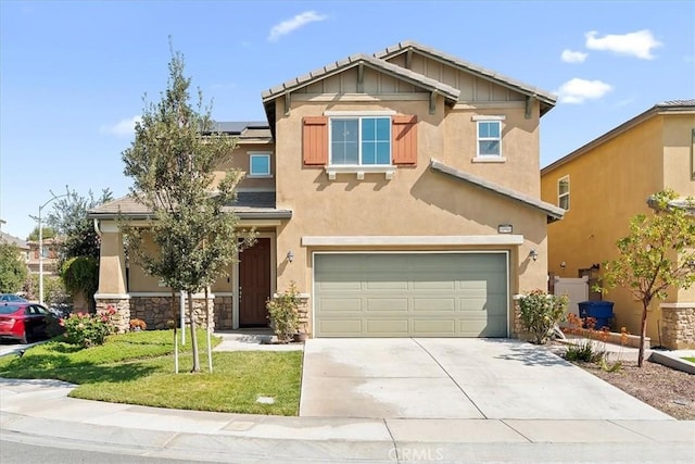 10969 Elkwood Cir, Riverside, CA 92503 - view of front facade with an attached garage, stucco siding, concrete driveway, solar panels, and a front lawn