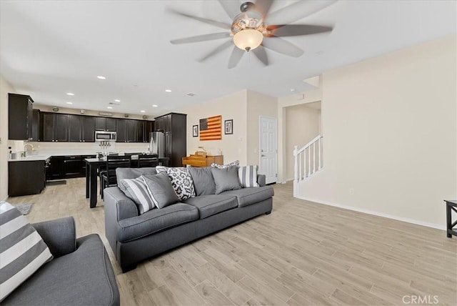 10969 Elkwood Cir, Riverside, CA 92503 - living room featuring ceiling fan, light wood-style floors, recessed lighting, and baseboards