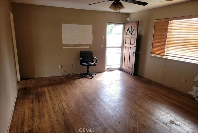 spare room featuring a ceiling fan and wood finished floors