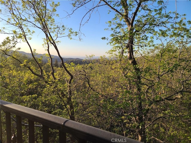 property view of mountains featuring a view of trees