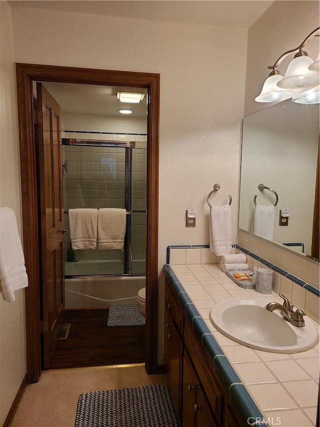 28662 Zion Dr, Lake Arrowhead, CA 92352 - full bathroom featuring vanity and bath / shower combo with glass door