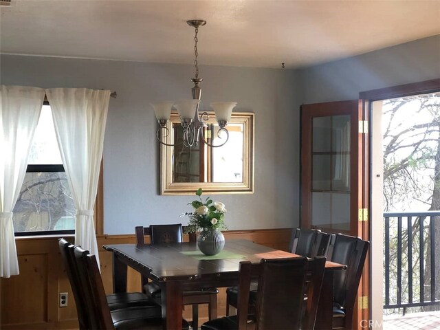 28662 Zion Dr, Lake Arrowhead, CA 92352 - dining room featuring a chandelier and a wainscoted wall