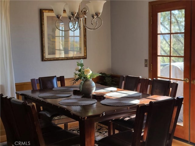 dining space featuring a notable chandelier