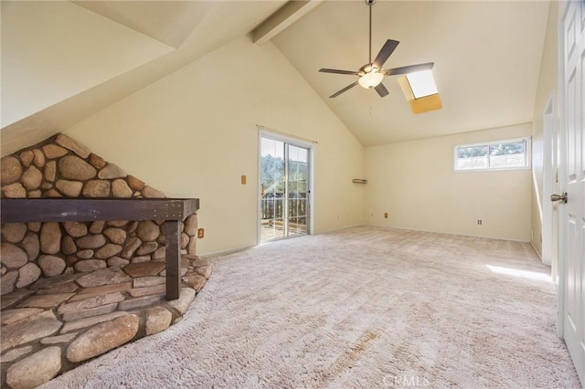 14521 Voltaire Dr, Pine Mountain Club, CA 93222 - unfurnished living room featuring ceiling fan, carpet flooring, plenty of natural light, beamed ceiling, and high vaulted ceiling