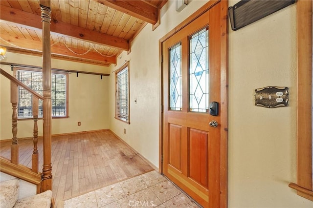 14521 Voltaire Dr, Pine Mountain Club, CA 93222 - foyer featuring wood ceiling with exposed beams, stairway, and baseboards