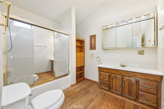14521 Voltaire Dr, Pine Mountain Club, CA 93222 - bathroom featuring toilet, lofted ceiling, hardwood / wood-style floors, a shower with shower door, and vanity