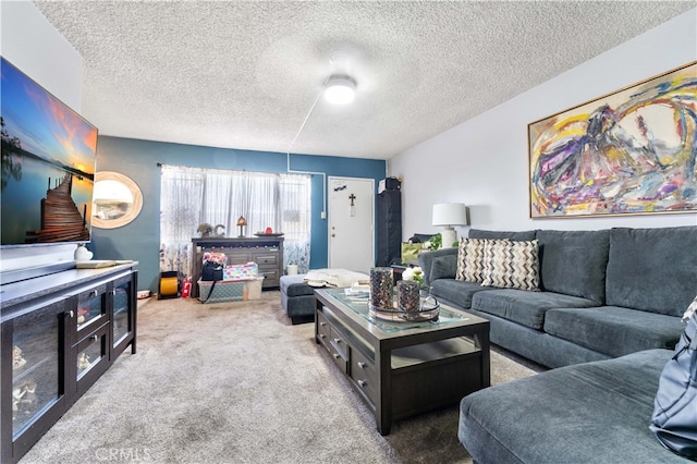living area featuring carpet flooring and a textured ceiling