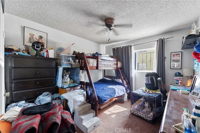 bedroom with carpet, a textured ceiling, and a ceiling fan
