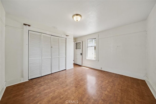 1811 Chorro St, San Luis Obispo, CA 93401 - unfurnished bedroom with a closet, baseboards, and wood finished floors