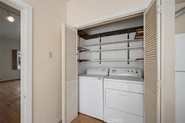 1811 Chorro St, San Luis Obispo, CA 93401 - laundry area featuring laundry area, washing machine and dryer, and light wood-style floors