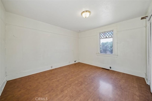 1811 Chorro St, San Luis Obispo, CA 93401 - empty room featuring visible vents, baseboards, and wood finished floors
