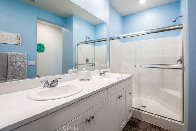 16540 Wyndham Ln Unit 10, Fontana, CA 92336 - bathroom featuring a shower stall and double vanity
