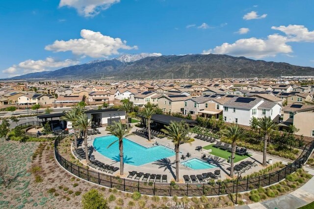 16540 Wyndham Ln Unit 10, Fontana, CA 92336 - community pool featuring a residential view, a mountain view, and a patio