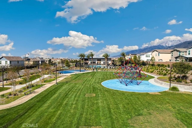 16540 Wyndham Ln Unit 10, Fontana, CA 92336 - view of grassy yard with a residential view and a mountain view