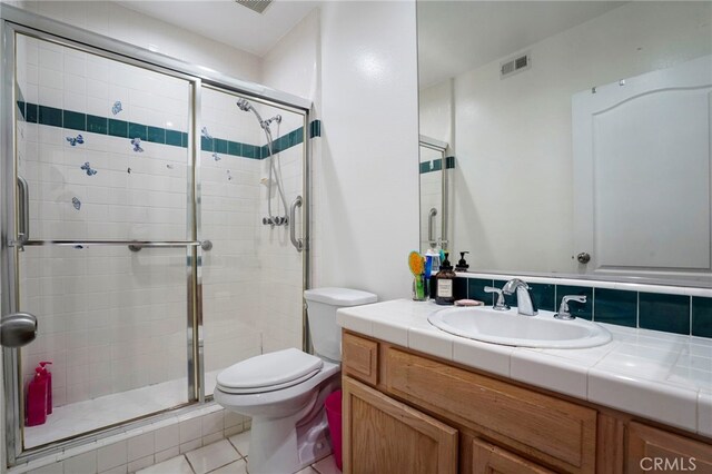 5224 Zelzah Ave Unit 108, Encino, CA 91316 - bathroom with toilet, tile patterned floors, visible vents, a shower stall, and vanity