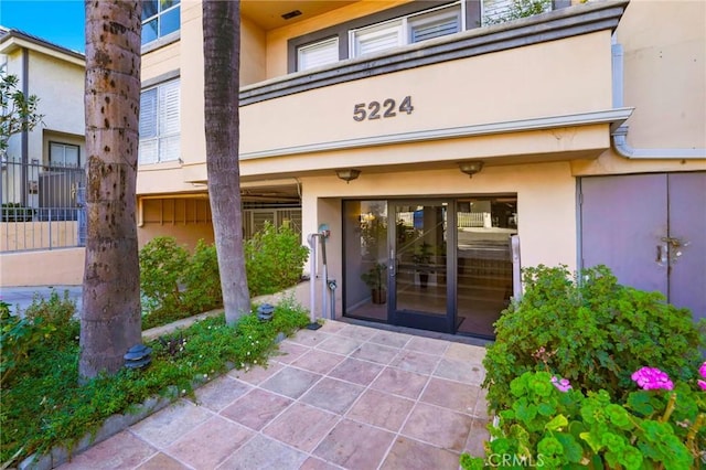 5224 Zelzah Ave Unit 108, Encino, CA 91316 - doorway to property featuring stucco siding