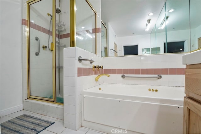 5224 Zelzah Ave Unit 108, Encino, CA 91316 - bathroom with tile patterned floors, a stall shower, and a garden tub