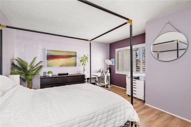 bedroom with wood finished floors