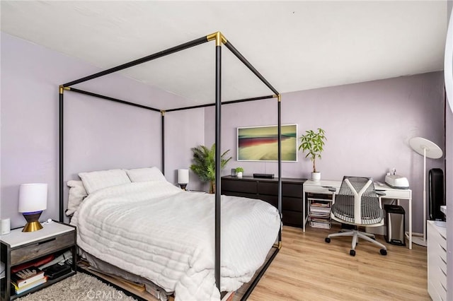bedroom featuring wood finished floors