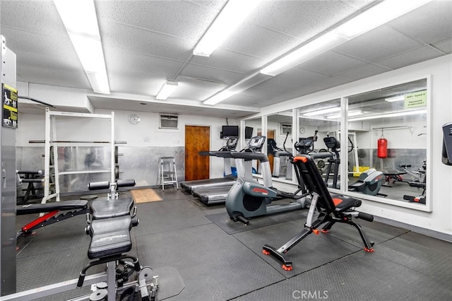 exercise room with a drop ceiling