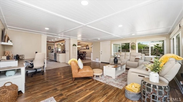 living area featuring wood finished floors and recessed lighting