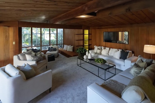 carpeted living room with wooden ceiling, wooden walls, and beam ceiling