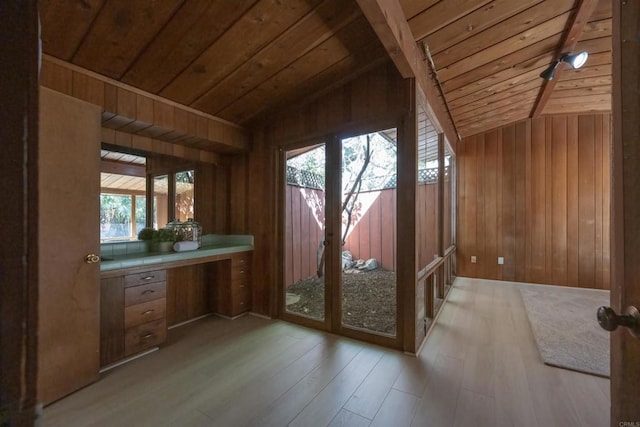 doorway to outside with wooden ceiling, vaulted ceiling, and wood finished floors