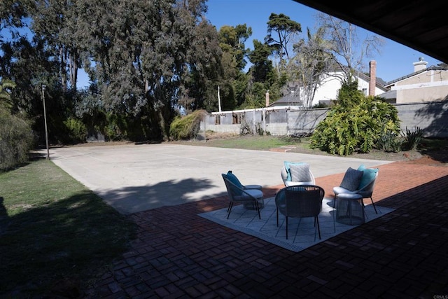 view of patio / terrace featuring fence