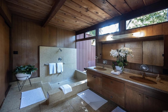 full bathroom with a sink, double vanity, walk in shower, wood walls, and wooden ceiling