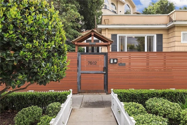 view of gate featuring fence