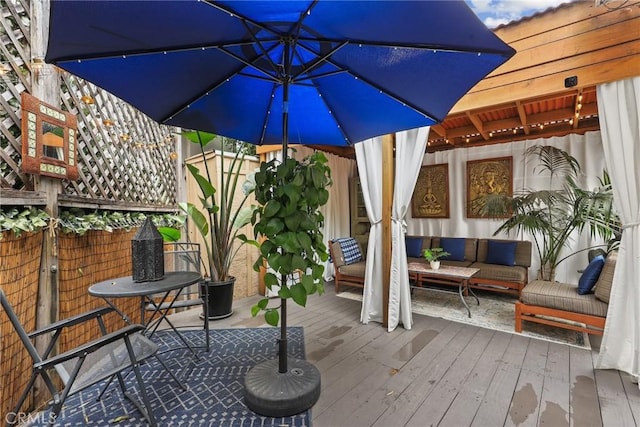 exterior space with outdoor lounge area and a wooden deck