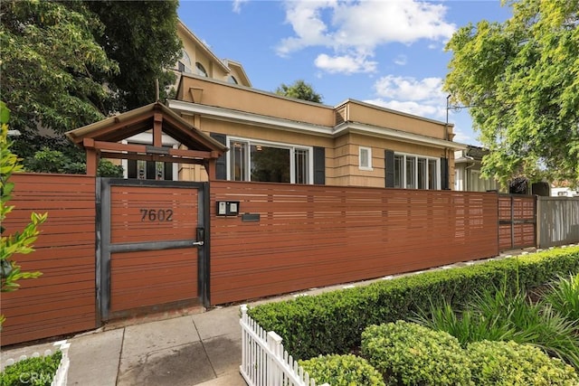 view of gate featuring fence